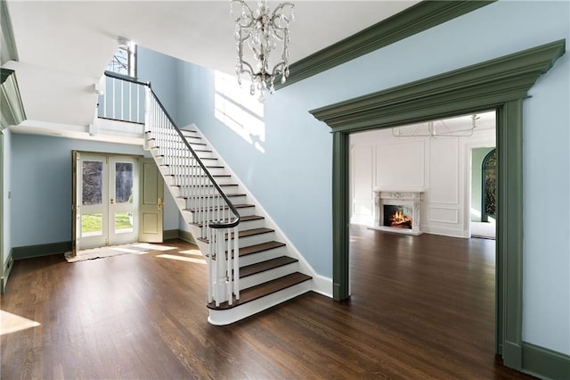 3051 Habersham Rd NW, Atlanta, GA 30305 - staircase with baseboards, wood finished floors, and french doors