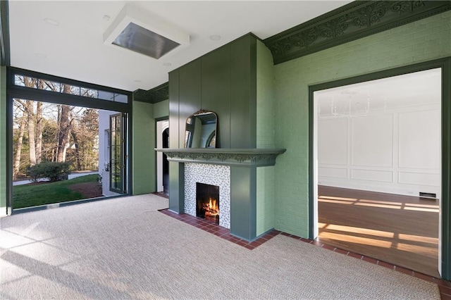 3051 Habersham Rd NW, Atlanta, GA 30305 - unfurnished living room featuring a fireplace and carpet flooring