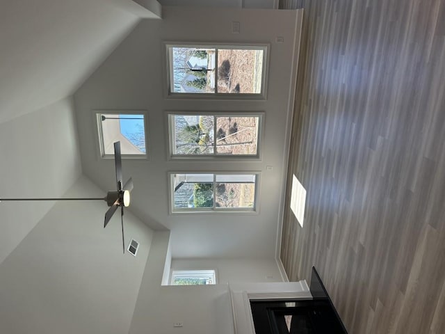 living room featuring visible vents and lofted ceiling