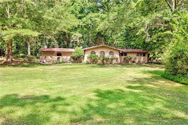 exterior space featuring a front lawn