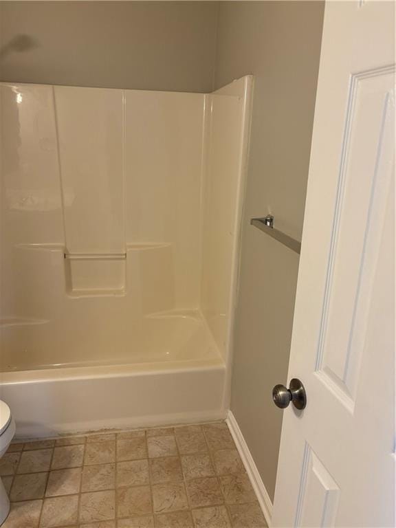 bathroom with  shower combination and toilet