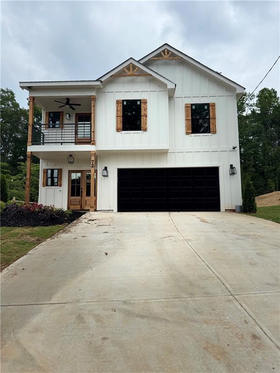 172 Llewellyn, Clarkesville, GA 30523 - modern farmhouse featuring a balcony, a garage, board and batten siding, and concrete driveway