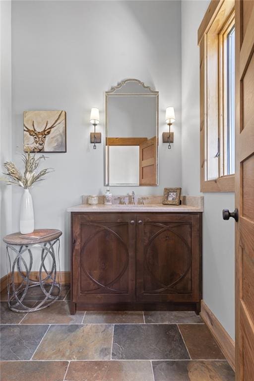 bathroom with oversized vanity and tile floors