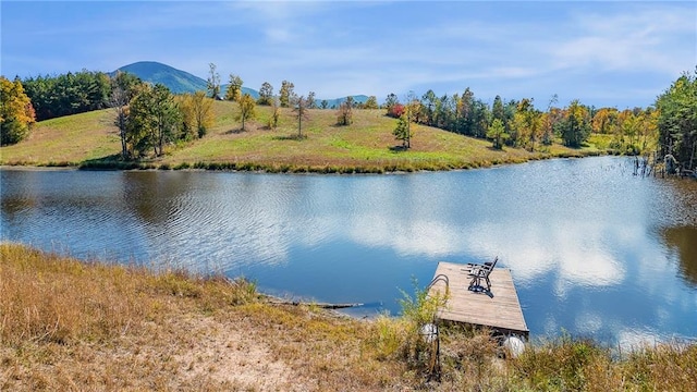 dock area featuring a water and mountain view