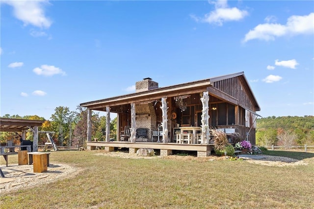 rear view of house with a lawn