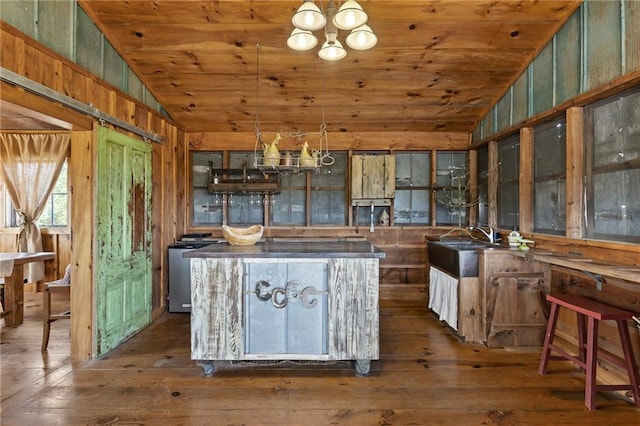 kitchen with an inviting chandelier, wooden ceiling, dark wood-type flooring, and lofted ceiling