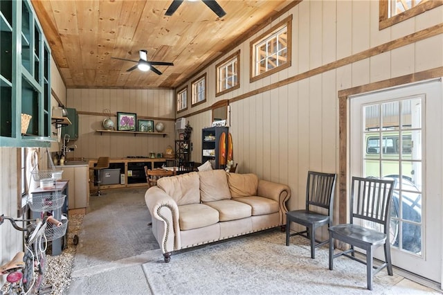 living room with high vaulted ceiling, ceiling fan, and wooden ceiling