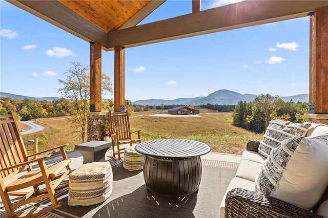 view of patio / terrace featuring a mountain view