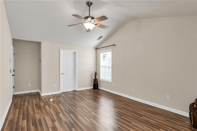 unfurnished bedroom with lofted ceiling, dark wood-style flooring, baseboards, and ceiling fan
