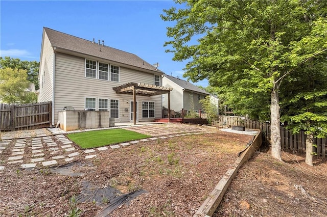 back of house with a pergola, a patio, and a fenced backyard