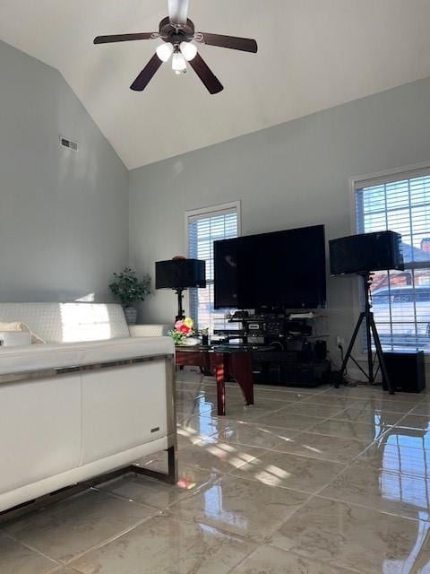 living room with high vaulted ceiling and ceiling fan