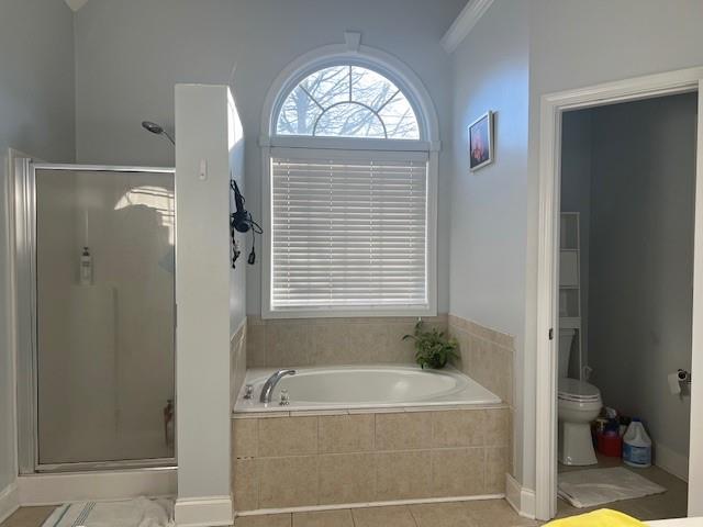 bathroom with shower with separate bathtub, crown molding, and toilet