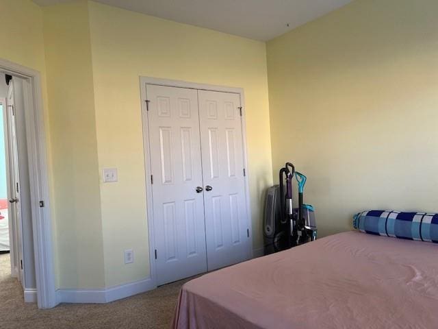 carpeted bedroom featuring a closet