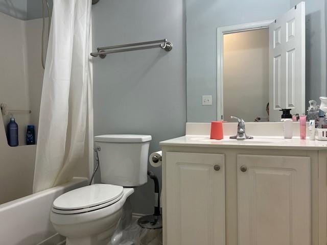 full bathroom featuring shower / tub combo, vanity, and toilet