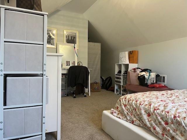 bedroom with light carpet and vaulted ceiling