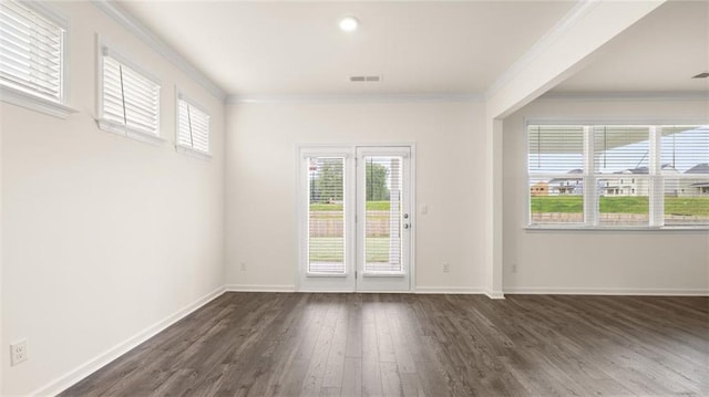 interior space with dark wood-type flooring and ornamental molding