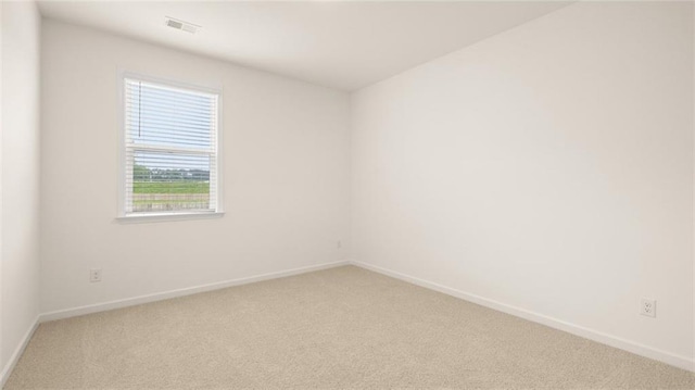 unfurnished room featuring carpet flooring