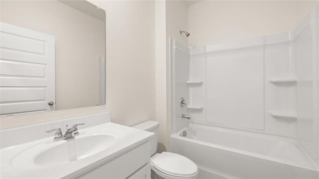 full bathroom with bathing tub / shower combination, vanity, and toilet