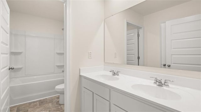 full bathroom with toilet, bathing tub / shower combination, and vanity