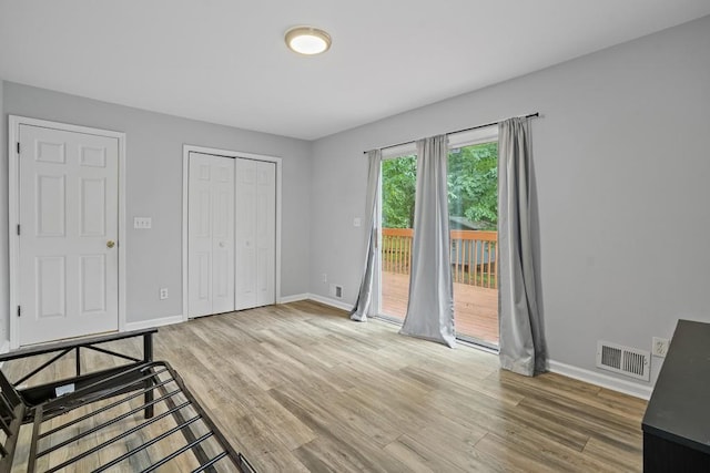 interior space with light hardwood / wood-style flooring and access to exterior