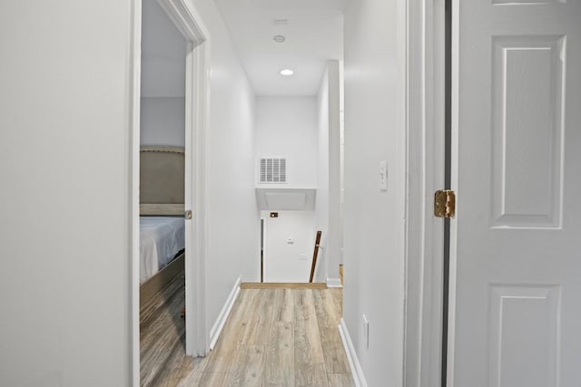 hallway featuring light hardwood / wood-style flooring