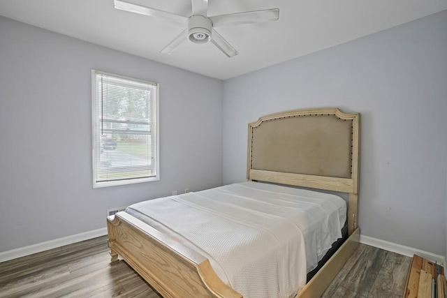 bedroom featuring wood-type flooring and ceiling fan