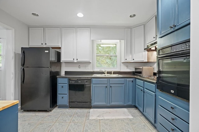 kitchen featuring light tile patterned floors, sink, white cabinetry, blue cabinetry, and black appliances