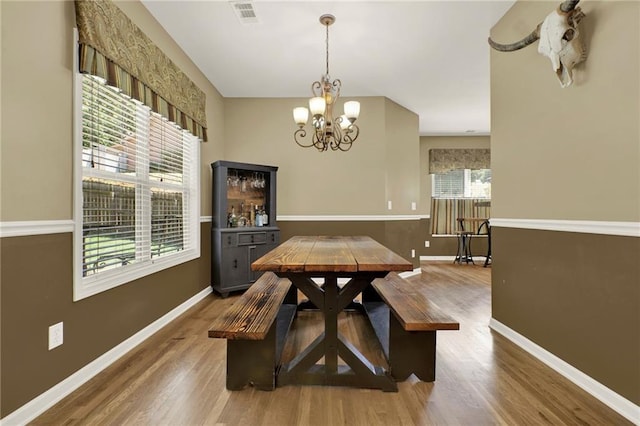 34 Laurel Way NE, White, GA 30184 - dining room with a chandelier, wood finished floors, and baseboards