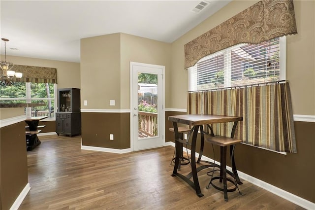 34 Laurel Way NE, White, GA 30184 - dining area featuring a chandelier, wood finished floors, and baseboards