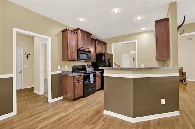 34 Laurel Way NE, White, GA 30184 - kitchen with black appliances, light wood-style floors, baseboards, a peninsula, and recessed lighting