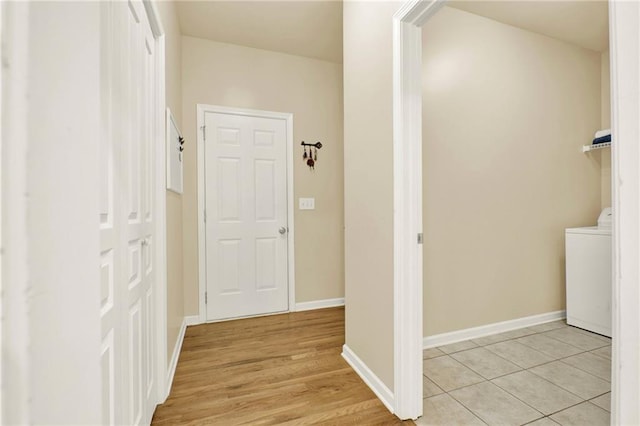 34 Laurel Way NE, White, GA 30184 - laundry room featuring washer / clothes dryer, baseboards, and light wood-style flooring