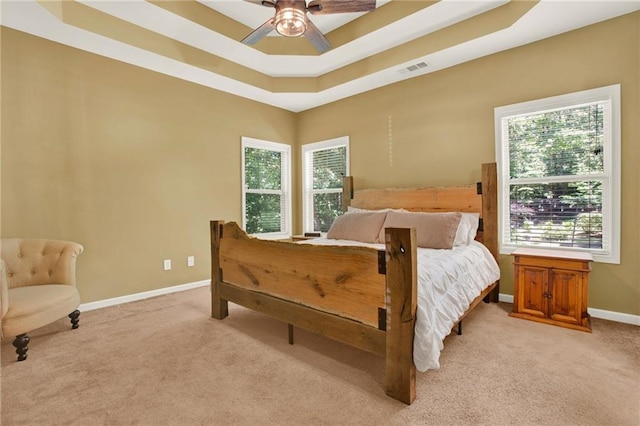 34 Laurel Way NE, White, GA 30184 - bedroom with light carpet, baseboards, a tray ceiling, and ceiling fan