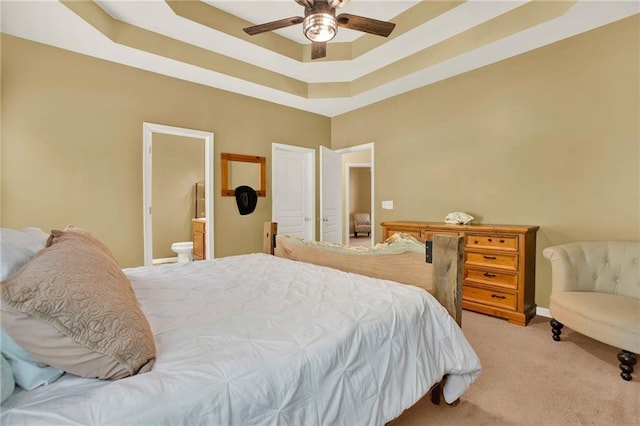 34 Laurel Way NE, White, GA 30184 - bedroom featuring a tray ceiling, light carpet, connected bathroom, baseboards, and ceiling fan