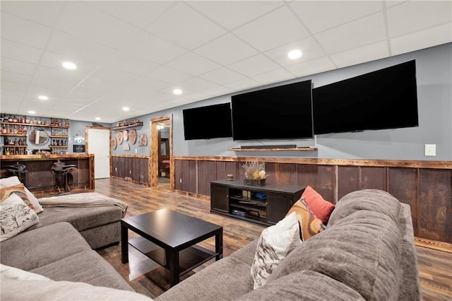 34 Laurel Way NE, White, GA 30184 - living room featuring bar area, wainscoting, wood finished floors, and a paneled ceiling