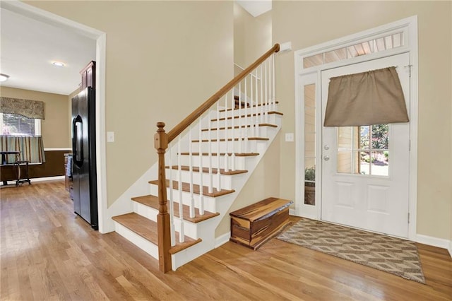 34 Laurel Way NE, White, GA 30184 - foyer with light wood-style flooring, plenty of natural light, stairway, and baseboards