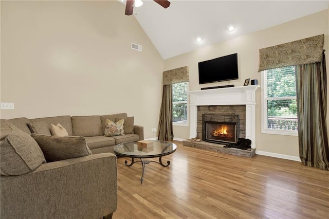 34 Laurel Way NE, White, GA 30184 - living area featuring ceiling fan, a fireplace, high vaulted ceiling, plenty of natural light, and wood finished floors