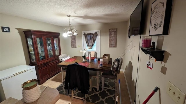 carpeted dining room with a notable chandelier and a textured ceiling