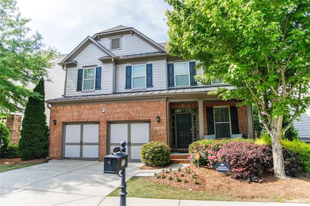 6892 Big Sky Dr, Flowery Branch, GA 30542 - craftsman-style home featuring a standing seam roof, driveway, and brick siding