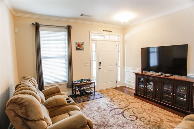 6892 Big Sky Dr, Flowery Branch, GA 30542 - living room with wood finished floors, crown molding, and wainscoting