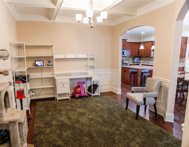 6892 Big Sky Dr, Flowery Branch, GA 30542 - living area featuring dark wood-type flooring, arched walkways, ornamental molding, coffered ceiling, and a chandelier