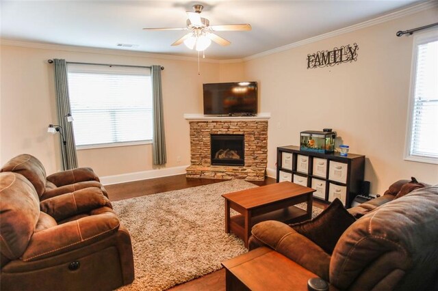 6892 Big Sky Dr, Flowery Branch, GA 30542 - living area featuring ceiling fan, a fireplace, wood finished floors, crown molding, and baseboards