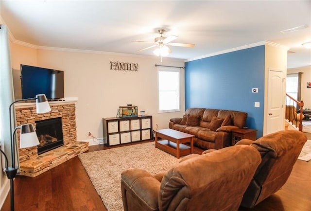 6892 Big Sky Dr, Flowery Branch, GA 30542 - living room with ceiling fan, wood finished floors, healthy amount of natural light, ornamental molding, and a fireplace