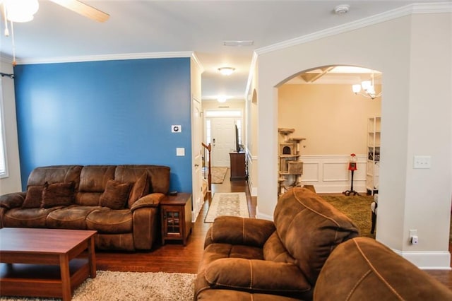 6892 Big Sky Dr, Flowery Branch, GA 30542 - living room featuring arched walkways, wood finished floors, ornamental molding, and a ceiling fan