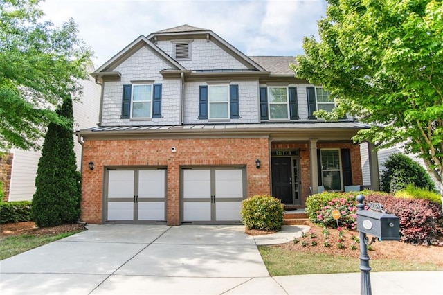 6892 Big Sky Dr, Flowery Branch, GA 30542 - craftsman-style house featuring an attached garage, concrete driveway, brick siding, and a standing seam roof