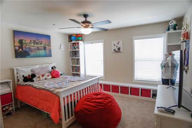 6892 Big Sky Dr, Flowery Branch, GA 30542 - carpeted bedroom with a ceiling fan