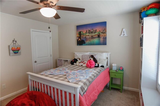 6892 Big Sky Dr, Flowery Branch, GA 30542 - carpeted bedroom with baseboards and a ceiling fan