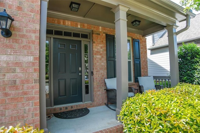 6892 Big Sky Dr, Flowery Branch, GA 30542 - entrance to property with a porch and brick siding