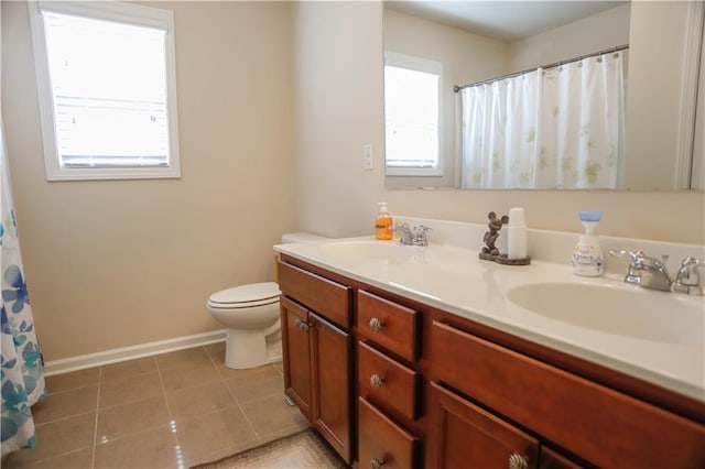 6892 Big Sky Dr, Flowery Branch, GA 30542 - bathroom with toilet, baseboards, double vanity, and tile patterned flooring