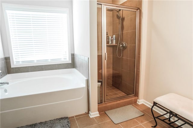 6892 Big Sky Dr, Flowery Branch, GA 30542 - full bathroom with a shower stall, tile patterned floors, and a garden tub