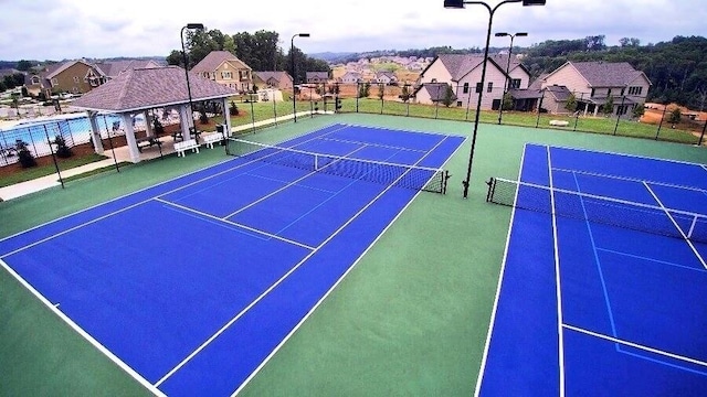 6892 Big Sky Dr, Flowery Branch, GA 30542 - view of tennis court featuring fence and a residential view